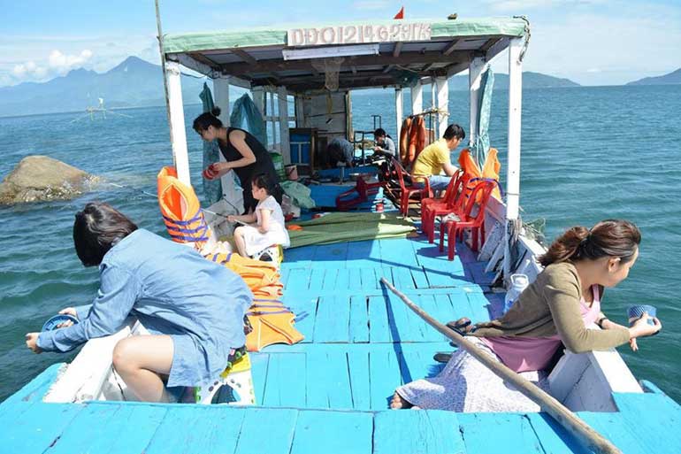 Going to Cham Island by local ferry